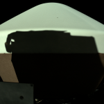 Shadow of REXIS instrument projected onto OSIRIS-REx Sample Return Capsule